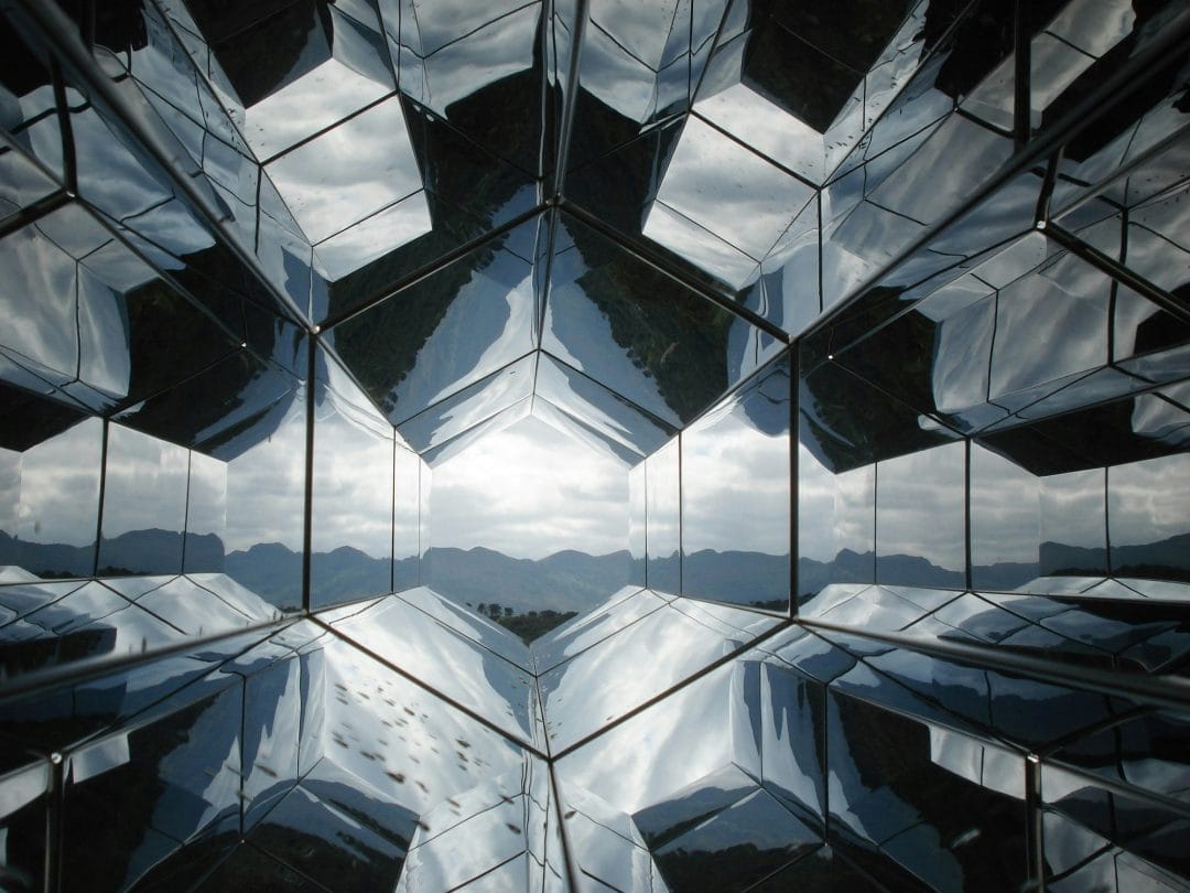 Mirror dream meaning – image of a mirror reflecting a shadowy figure, representing self-reflection, truth, and hidden aspects of the self in dreams.